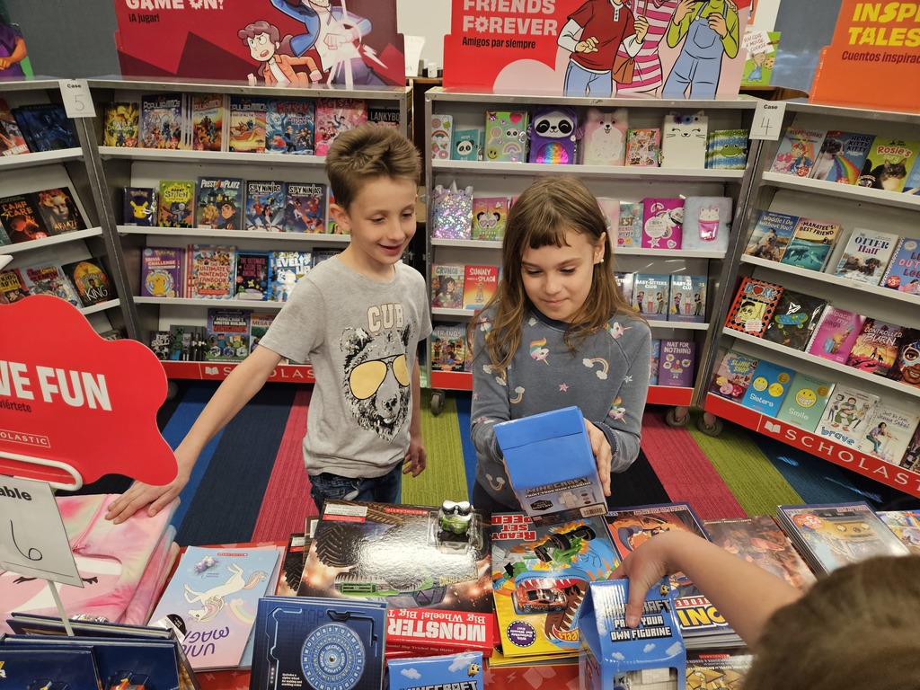 students looking at books